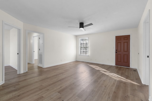 spare room featuring ceiling fan and light hardwood / wood-style flooring