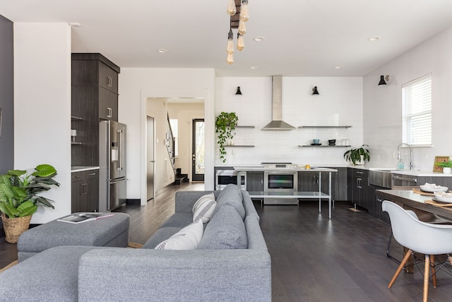 living room featuring recessed lighting and dark wood-style flooring