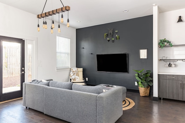 living area with recessed lighting, baseboards, and dark wood-style flooring