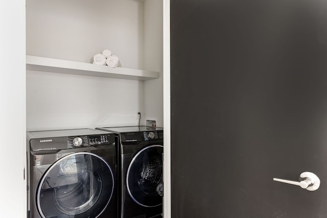 laundry room with separate washer and dryer