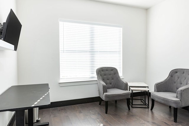 sitting room featuring baseboards and wood finished floors