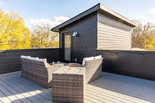 wooden terrace featuring a jacuzzi