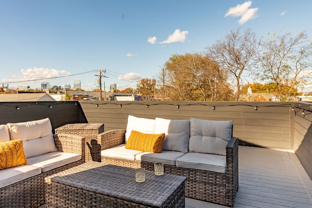 wooden terrace featuring outdoor lounge area