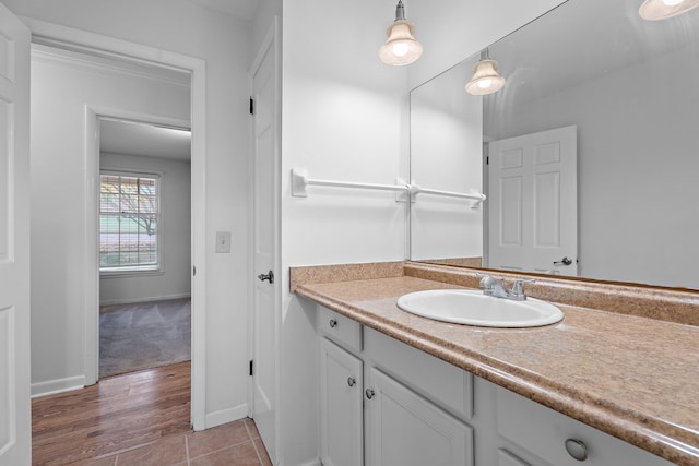 bathroom with vanity and wood-type flooring