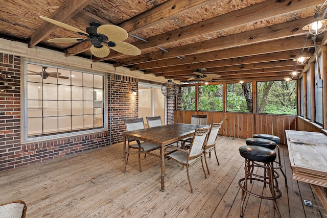 sunroom with beam ceiling