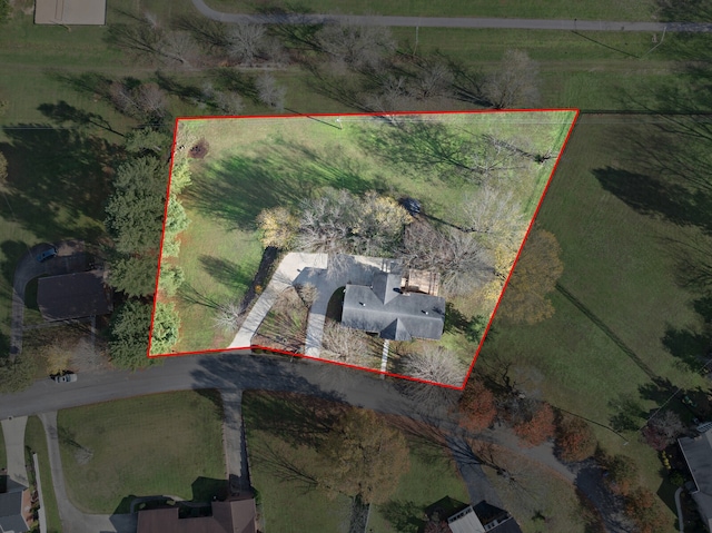 birds eye view of property with a rural view