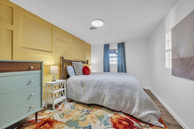 bedroom featuring hardwood / wood-style floors