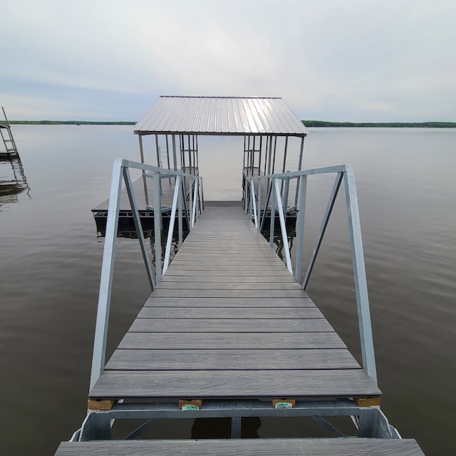 dock area featuring a water view