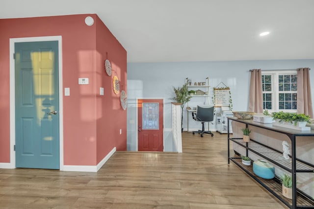 foyer entrance with light hardwood / wood-style flooring