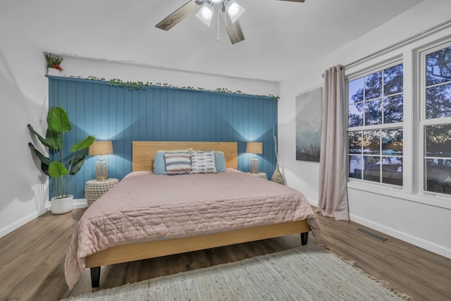 bedroom featuring ceiling fan and hardwood / wood-style floors