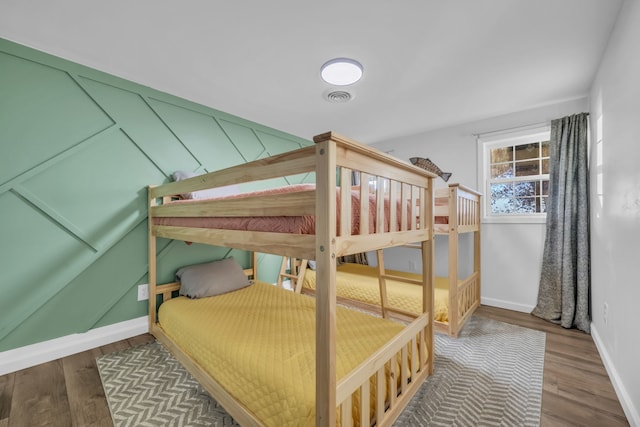 bedroom with wood-type flooring