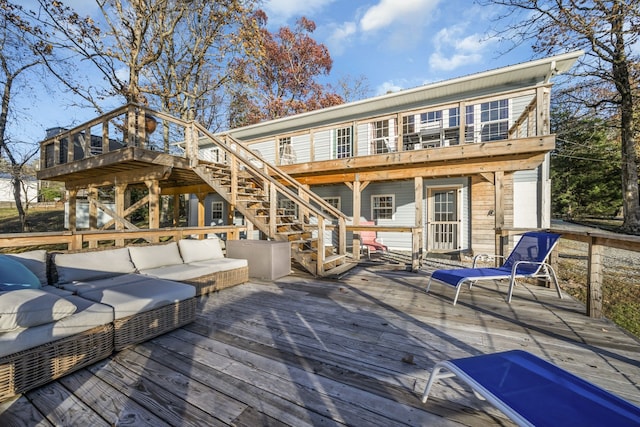 rear view of house with an outdoor living space and a deck