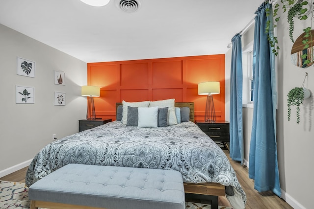 bedroom featuring hardwood / wood-style flooring