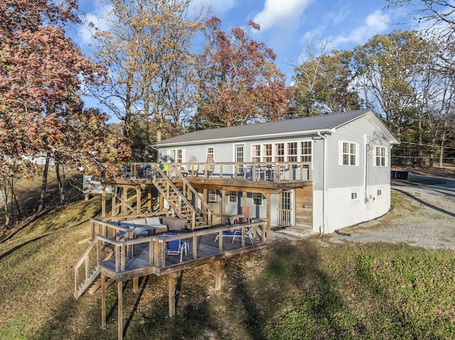 back of property featuring a deck