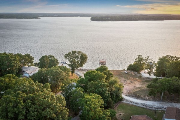 aerial view at dusk with a water view