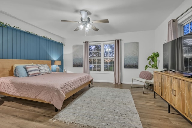 bedroom featuring ceiling fan and hardwood / wood-style flooring