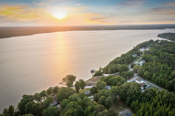 aerial view at dusk with a water view