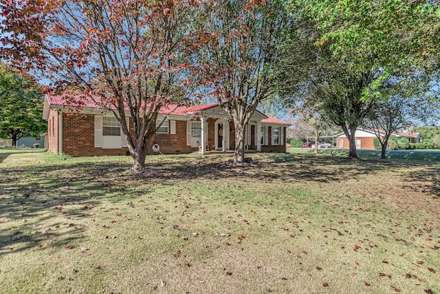 ranch-style house featuring a front lawn