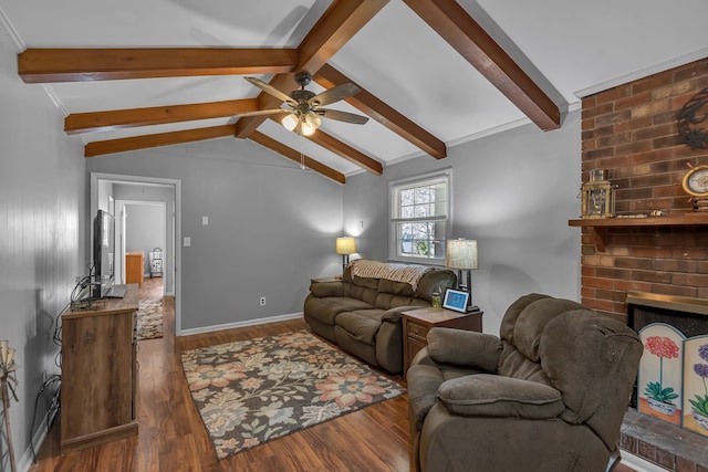 living room featuring lofted ceiling with beams, a brick fireplace, ceiling fan, and dark wood-type flooring