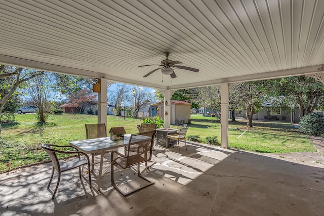 view of patio / terrace featuring a storage unit and ceiling fan