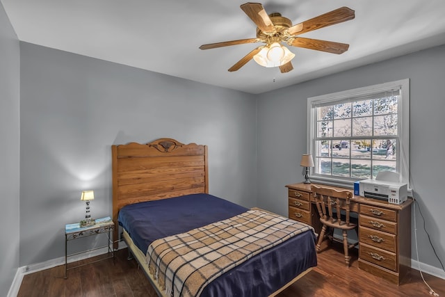 bedroom with dark hardwood / wood-style floors and ceiling fan