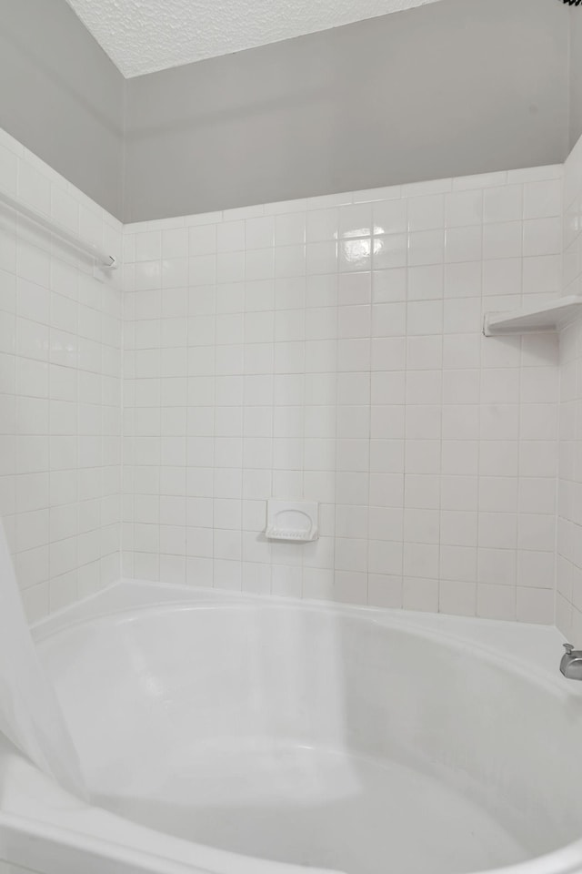 2027 Stokes Ln, Nashville, TN 37215 - bathroom featuring a textured ceiling and shower / tub combination