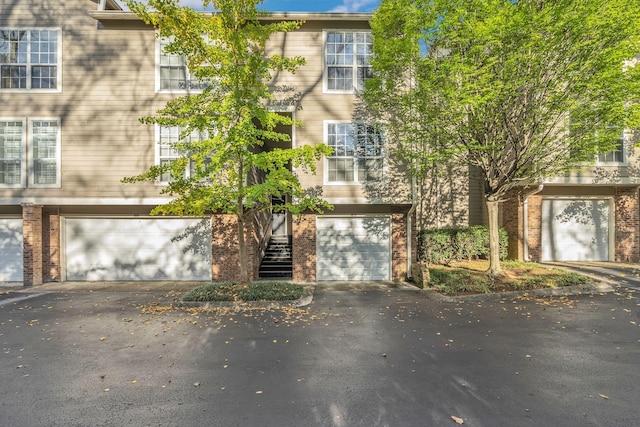 2027 Stokes Ln, Nashville, TN 37215 - multi unit property with driveway, an attached garage, and brick siding