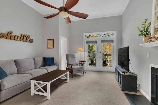2027 Stokes Ln, Nashville, TN 37215 - carpeted living area featuring french doors, ornamental molding, ceiling fan, and a towering ceiling