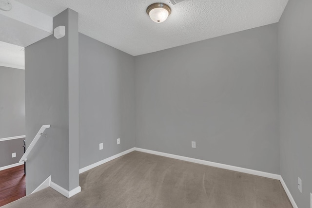 2027 Stokes Ln, Nashville, TN 37215 - carpeted spare room featuring baseboards and a textured ceiling