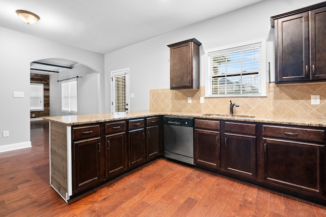 kitchen featuring kitchen peninsula, dishwasher, dark hardwood / wood-style floors, and sink