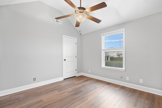 spare room with ceiling fan, hardwood / wood-style floors, and lofted ceiling