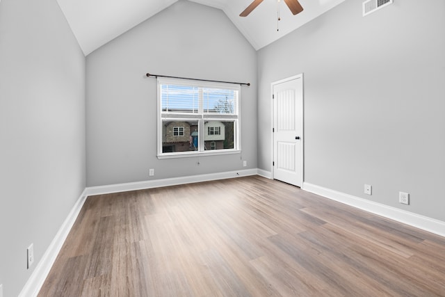 unfurnished room featuring ceiling fan, light hardwood / wood-style floors, and high vaulted ceiling