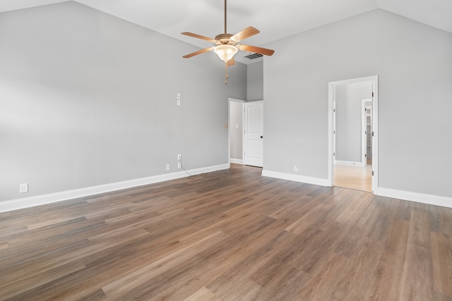 unfurnished room with ceiling fan, high vaulted ceiling, and hardwood / wood-style flooring