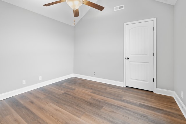 unfurnished room featuring ceiling fan, vaulted ceiling, and hardwood / wood-style flooring