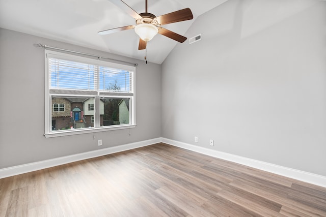 unfurnished room featuring hardwood / wood-style flooring, ceiling fan, and lofted ceiling