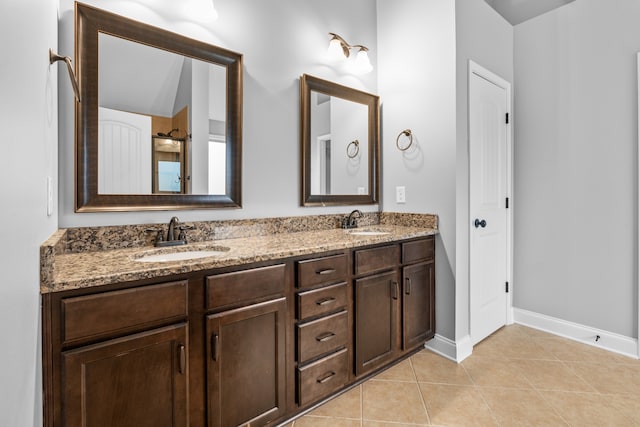 bathroom with tile patterned flooring and vanity