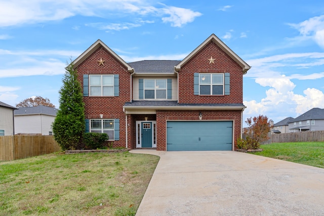 view of front of home with a garage and a front lawn