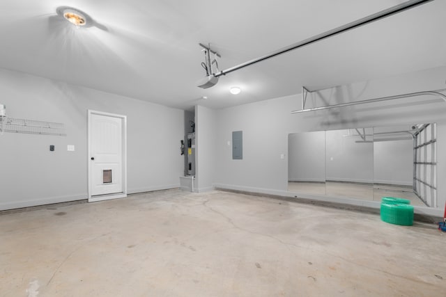 garage with a garage door opener, electric panel, and water heater