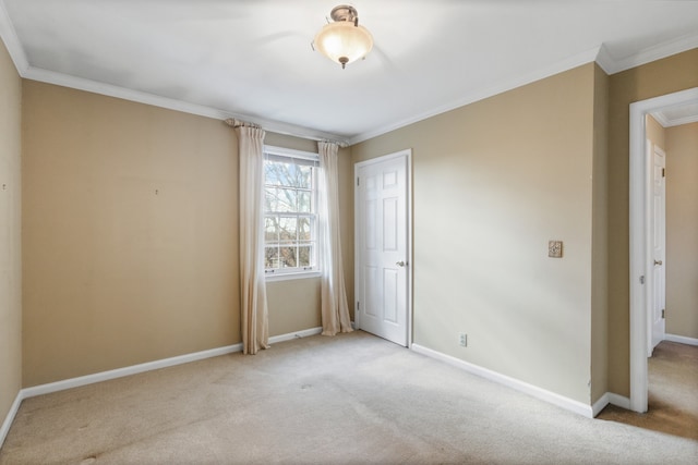 carpeted spare room with ornamental molding