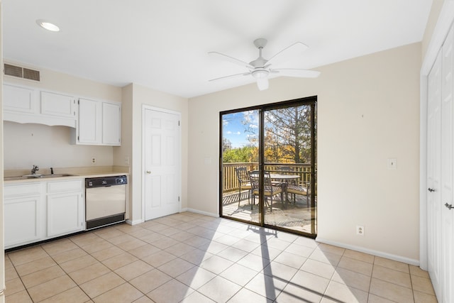 kitchen with white cabinetry, dishwasher, sink, ceiling fan, and light tile patterned floors