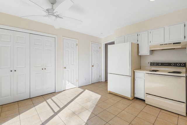 kitchen with white cabinets, white appliances, and light tile patterned floors