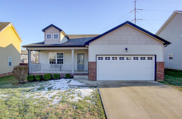 view of front of property featuring covered porch and a garage