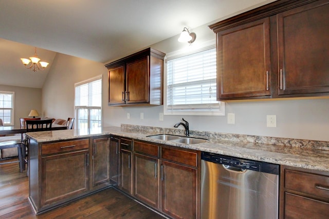 kitchen featuring dishwasher, sink, plenty of natural light, a notable chandelier, and vaulted ceiling