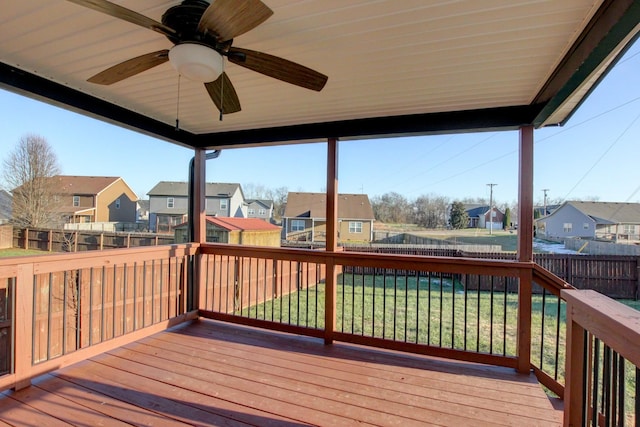 deck with ceiling fan and a lawn