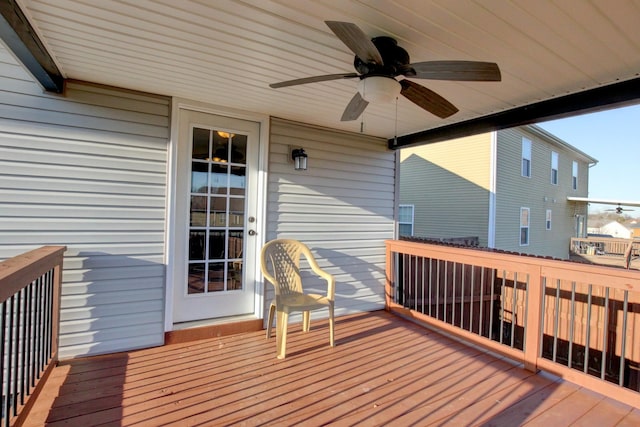 wooden deck featuring ceiling fan