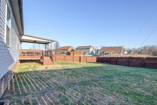 view of yard featuring a wooden deck