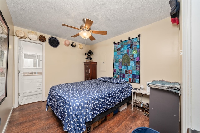 bedroom featuring a textured ceiling, dark hardwood / wood-style floors, ceiling fan, and ensuite bathroom