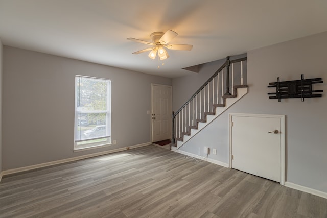 interior space with hardwood / wood-style flooring and ceiling fan