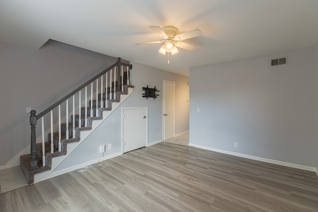 interior space featuring hardwood / wood-style floors and ceiling fan