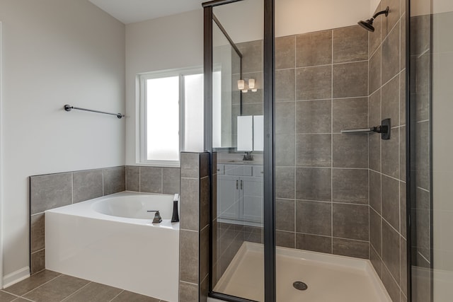 bathroom with tile patterned floors and plus walk in shower